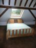 Low Level Oak Bed  A solid oak bed in a similar style to other pieces shown on this bedroom page. It