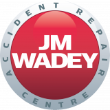 J M Wadey logo