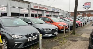 M J C Motors logo