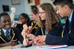 St Johns Priory School logo