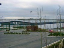 M E T logo