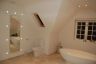 Family Bathroom with natural stone floor