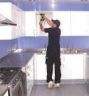 one of out team fitting a kitchen