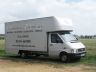 Woodbridge Removal's van and Stonehenge