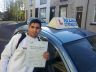Atif - holding his driving certificate