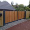 Metal framed wooden infill panels electric gates
