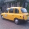Six Seater Yellow London Taxi