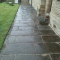York stone path taken up and relaid around a church.