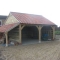 two bay cart shed with open log store