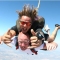 Tandem skydive smiling at camera