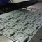 CNC punching sheet metal panels on a Trumpf 3000 CNC punch press in Fareham, Hampshire.