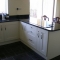 cream painted kitchen with star galaxy granit