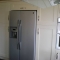 cream kitchen with american fridge freezer