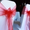 Spandex chair covers with red organza sashes
