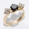 18ct gold white and black diamond three stone ring.