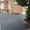 Set back from road through pillared access