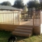 large raised deck with handrails
