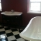 Red bathroom, black and white floor