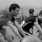 Andrew Cox (centre) warms up for a track race