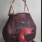 Hand-carved leather with hidden lower compartment that can carry 10cm heels