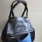 Classic black leather handbag with lower compartment for heels shown!