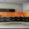 a striking floating kitchen with glass splashbacks