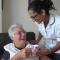 Care worker providing a drink for the Service User