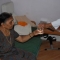Care worker giving glass of water
