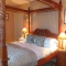 Queen Anne Four Poster Bedroom in a Honey stained finish.