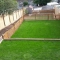 Landscaped garden with retaining walls and grass