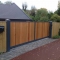 Metal framed wooden infill panels electric gates